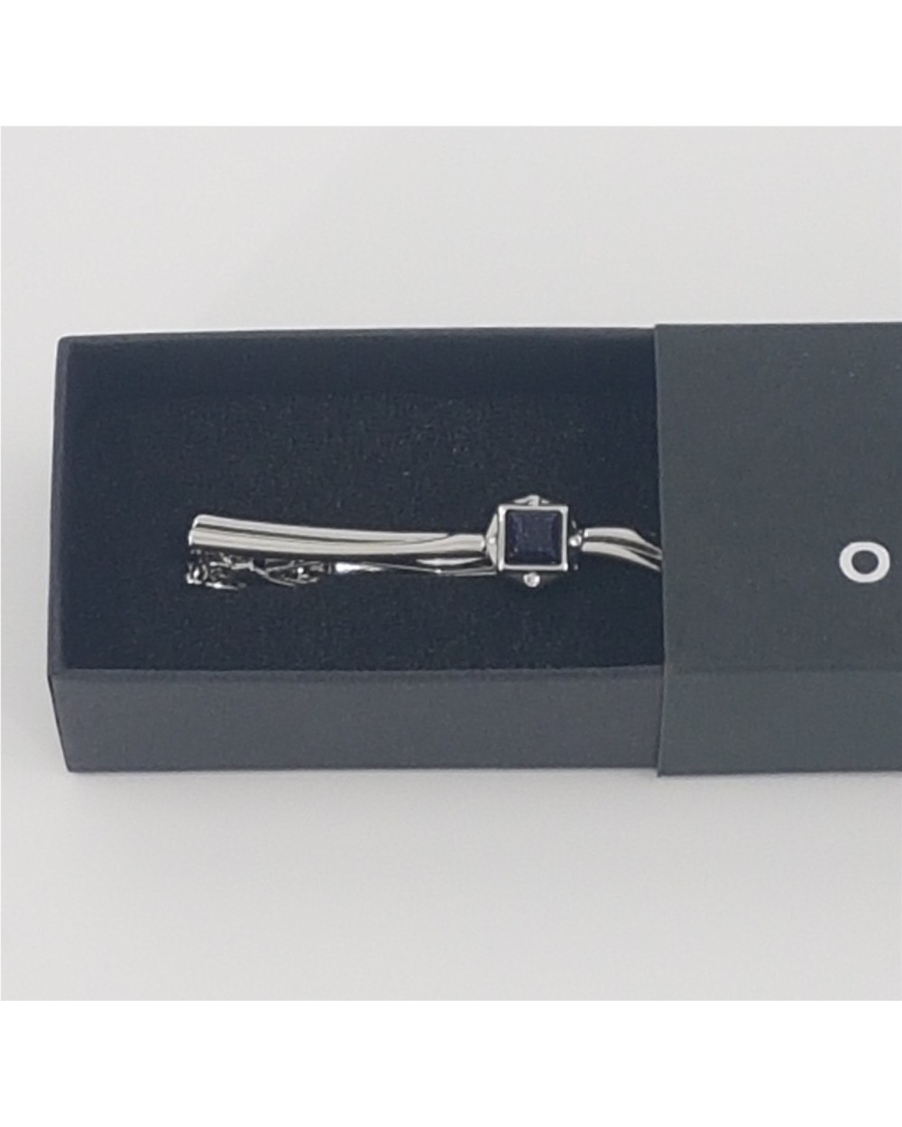 ALFILER DE CORBATA CURVO CON PIEDRA AZUL